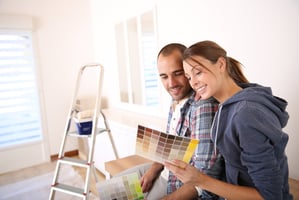 couple remodeling and painting their home