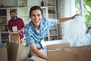 Happy couple unpacking