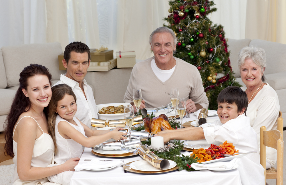 family around a table during the holidays