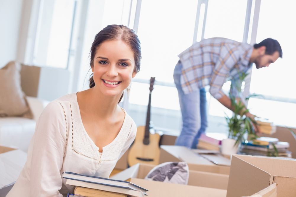 couple unpacking boxes