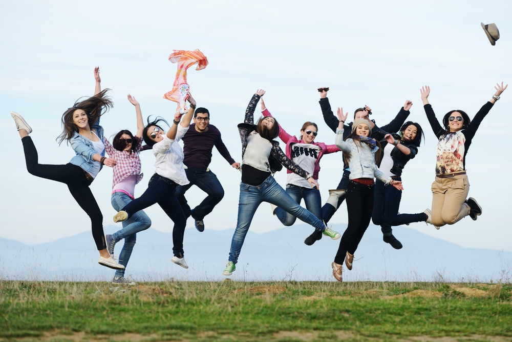 Happy people jumping in the air