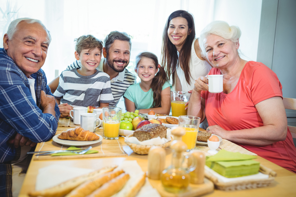 happy multi-gen family at the kitchen table